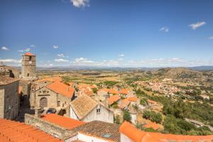 an aerial view of a town with a clock tower at Casa das 10 Janelas @ Monsanto in Monsanto