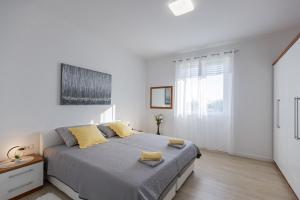 Ein Bett oder Betten in einem Zimmer der Unterkunft Guest House Anna