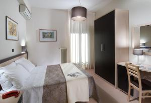 Postel nebo postele na pokoji v ubytování Hotel Conchiglia