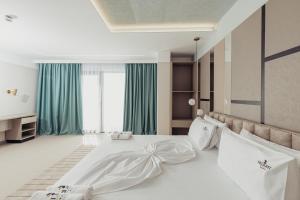 Postel nebo postele na pokoji v ubytování Delight Hotel & SPA