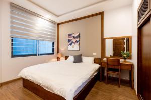 Ένα ή περισσότερα κρεβάτια σε δωμάτιο στο My Serenity Service Apartment - West Lake