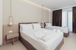 Postel nebo postele na pokoji v ubytování Delight Hotel & SPA