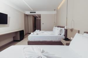Postel nebo postele na pokoji v ubytování Delight Hotel & SPA