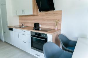Kuchyň nebo kuchyňský kout v ubytování Velden Appartements am Wörthersee