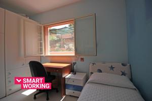 A bed or beds in a room at Villetta Santa Lucia con patio e giardino by Wonderful Italy