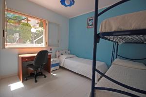 A bed or beds in a room at Villetta Santa Lucia con patio e giardino by Wonderful Italy