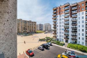 an aerial view of a parking lot in a city at Appartement 303 place Léopold 1er à la panne à 100m de la plage in De Panne