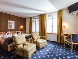 Ένα ή περισσότερα κρεβάτια σε δωμάτιο στο Hotel Oberland