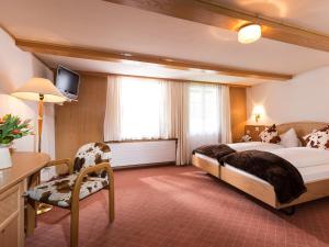 Ένα ή περισσότερα κρεβάτια σε δωμάτιο στο Hotel Oberland
