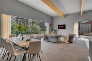 a dining room with a table and chairs at Fen Lane Lodge in Snetterton