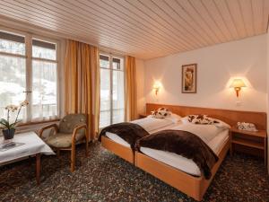 Ένα ή περισσότερα κρεβάτια σε δωμάτιο στο Hotel Oberland