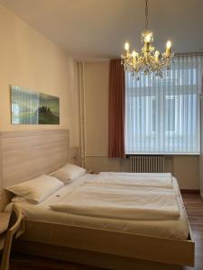 מיטה או מיטות בחדר ב-Pension Post Rüdesheim