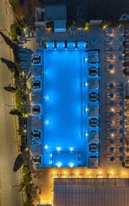 an overhead view of a pool at night at Nestor Hotel in Ayia Napa
