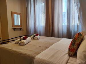 Postel nebo postele na pokoji v ubytování ML Saroko Apartment