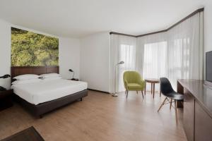 Postel nebo postele na pokoji v ubytování Neat Hotel Avenida