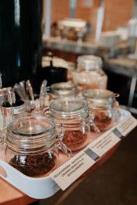 a display of jars of food on a table at Hotel Kokkola in Kokkola