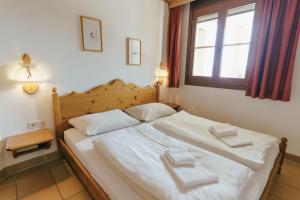 Postel nebo postele na pokoji v ubytování Apartment Zirbengeist Gerlitzen