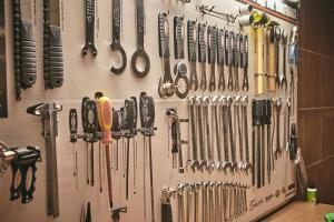 a bunch of knives hanging on a wall at Nura Santa Ponsa & Spa in Santa Ponsa