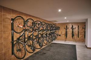 a row of bikes hanging on a wall at Nura Santa Ponsa & Spa in Santa Ponsa