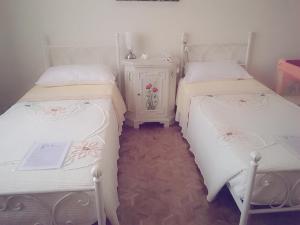 Postel nebo postele na pokoji v ubytování B&B Villa Adriano