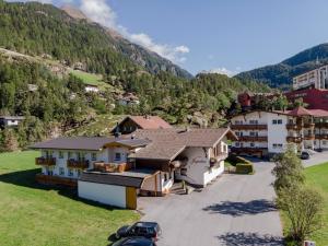 an aerial view of a village in the mountains at Pension Jaqueline in Sölden