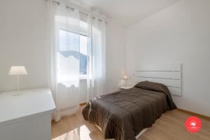 A bed or beds in a room at BUENA VIDA