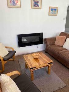 a living room with a couch and a coffee table at Large property which is all about location, location , location ! Lovely Comfortable 2 bedroom flat which is spacious and one of the best value properties of this size so close to the sea , beaches and restaurants 1 min to the sea ! in Lyme Regis