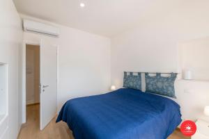 A bed or beds in a room at BUENA VIDA