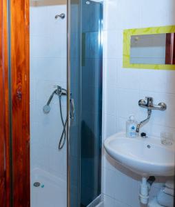a bathroom with a sink and a glass shower at 2- izbový APARTMÁN KAJKA v PENZION TRSTENÁ in Trstená