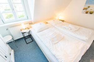 Ein Bett oder Betten in einem Zimmer der Unterkunft Haderslebener Str 28