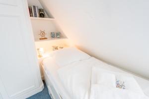 Ein Bett oder Betten in einem Zimmer der Unterkunft Haderslebener Str 28