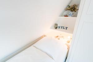 Ein Bett oder Betten in einem Zimmer der Unterkunft Haderslebener Str 28