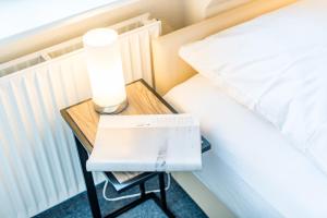 Ein Bett oder Betten in einem Zimmer der Unterkunft Haderslebener Str 28