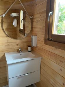 a bathroom with a sink and a mirror at O Rincón das Rías Baixas in Bueu