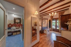 A bed or beds in a room at La Fornal