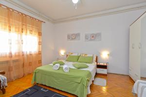 Ein Bett oder Betten in einem Zimmer der Unterkunft Apartment Silvio 1779
