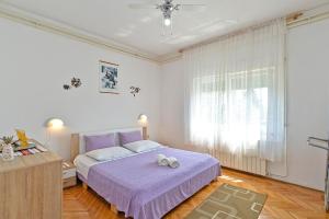 Ein Bett oder Betten in einem Zimmer der Unterkunft Apartment Silvio 1779