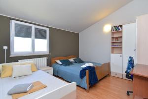 Ein Bett oder Betten in einem Zimmer der Unterkunft Apartment Silvio 1779