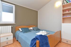 Ein Bett oder Betten in einem Zimmer der Unterkunft Apartment Silvio 1779