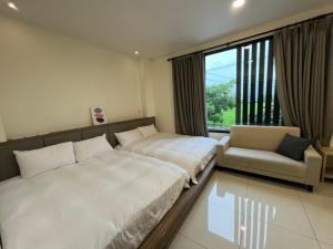 מיטה או מיטות בחדר ב-Lan Feng Su B&B