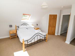 מיטה או מיטות בחדר ב-Kilkeeran Lodge