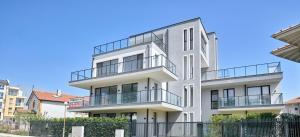 an image of a white building with balconies at The Penthouse in Ahtopol