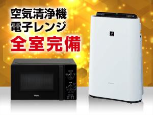 a microwave and a refrigerator with chinese writing on it at HOTEL LiVEMAX Kobe Sannomiya in Kobe