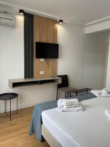 TV a/nebo společenská místnost v ubytování Hotel Unirea + 15 fotografií