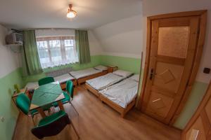 Postel nebo postele na pokoji v ubytování Dom Wczasowy Jesionkówka