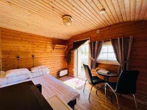 Ένα ή περισσότερα κρεβάτια σε δωμάτιο στο Camp Alta Kiruna