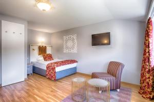 Postel nebo postele na pokoji v ubytování Parkhotel Adler