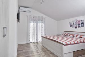 Postel nebo postele na pokoji v ubytování Apartments & Rooms Seaside