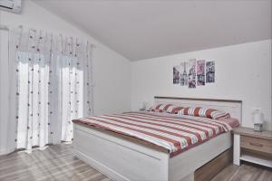 Postel nebo postele na pokoji v ubytování Apartments & Rooms Seaside