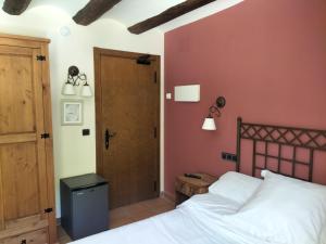 A bed or beds in a room at Hotel Molino Alto